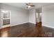 Hardwood floors enhance this bedroom, offering access to a bathroom and closet at 11939 Fiddlers Roof Ln, Charlotte, NC 28277