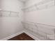 Walk-in closet featuring white wire shelving for optimal storage solutions at 11939 Fiddlers Roof Ln, Charlotte, NC 28277