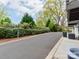 View of the driveway surrounded by lush landscaping at 11939 Fiddlers Roof Ln, Charlotte, NC 28277