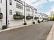 Exterior view of modern townhomes with garages and balconies at 11939 Fiddlers Roof Ln, Charlotte, NC 28277