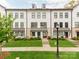 Charming townhomes with manicured lawns and classic black and white facade create curb appeal at 11939 Fiddlers Roof Ln, Charlotte, NC 28277