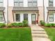 Close-up shot of the front entry, featuring professional landscaping at 11939 Fiddlers Roof Ln, Charlotte, NC 28277