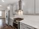 Modern kitchen featuring stainless steel appliances, gray cabinetry, and a gas range at 11939 Fiddlers Roof Ln, Charlotte, NC 28277