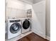 Laundry room featuring new washer and dryer with an easy access door at 11939 Fiddlers Roof Ln, Charlotte, NC 28277