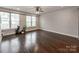 Bright and airy living room with hardwood floors and an abundance of natural light at 11939 Fiddlers Roof Ln, Charlotte, NC 28277