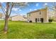 Lush backyard with patio set, ideal for relaxation and outdoor entertaining at 120 Vermillion Loop, Statesville, NC 28625