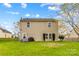 Spacious backyard with patio, grill, and manicured shrubbery at 120 Vermillion Loop, Statesville, NC 28625