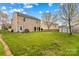 Expansive backyard with mature trees, offering ample space for outdoor activities at 120 Vermillion Loop, Statesville, NC 28625