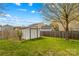 Spacious backyard featuring mature tree, shed, and lush green grass at 120 Vermillion Loop, Statesville, NC 28625