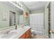 This bathroom features double sinks and a shower with a shower curtain at 120 Vermillion Loop, Statesville, NC 28625