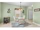 This quaint eat-in kitchen features a chandelier and natural light at 120 Vermillion Loop, Statesville, NC 28625