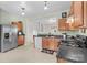 This eat-in kitchen features stainless steel appliances and wooden cabinets at 120 Vermillion Loop, Statesville, NC 28625