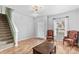 Inviting living room featuring staircase, hardwood floors, and natural light at 120 Vermillion Loop, Statesville, NC 28625