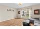 Cozy living room with hardwood floors, natural light, and comfortable seating at 120 Vermillion Loop, Statesville, NC 28625
