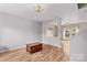 Bright living room featuring hardwood floors, natural light, and neutral tones at 120 Vermillion Loop, Statesville, NC 28625
