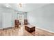 Bright living room with hardwood floors, stylish chairs, and natural light at 120 Vermillion Loop, Statesville, NC 28625