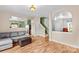 Open-concept living room with hardwood floors and neutral color palette at 120 Vermillion Loop, Statesville, NC 28625