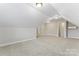 Bonus room featuring carpeted floors, white walls, a window, and a door at 132 Postell Dr, Statesville, NC 28625