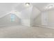Bonus room featuring carpeted floors, white walls, a window, and a door at 132 Postell Dr, Statesville, NC 28625