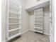 Walk-in closet with white shelving and carpet flooring at 132 Postell Dr, Statesville, NC 28625