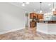 Kitchen with granite countertop, tile backsplash, stainless appliances, and open to dining room at 132 Postell Dr, Statesville, NC 28625