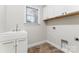 Laundry room with sink, white cabinets, window and tile flooring at 132 Postell Dr, Statesville, NC 28625