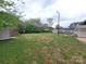 Large backyard featuring a grassy lawn and mature landscaping at 1421 Van Nuys St, Salisbury, NC 28144