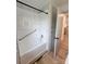 A clean, well-lit bathroom with a white shower-tub combo, linen closet, and modern fixtures at 1421 Van Nuys St, Salisbury, NC 28144