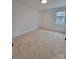 A cozy bedroom features neutral carpet and bright natural light from a window at 1421 Van Nuys St, Salisbury, NC 28144