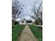 Inviting one-story home framed by trees, featuring a well-maintained lawn and classic architecture at 1421 Van Nuys St, Salisbury, NC 28144