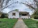 Charming single-story home with a tidy front lawn and inviting light blue entry door at 1421 Van Nuys St, Salisbury, NC 28144