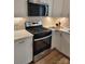 Updated kitchen with stainless steel oven and microwave, complemented by light countertops and cabinetry at 1421 Van Nuys St, Salisbury, NC 28144