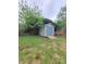 Backyard featuring a shed with a ramp for easy access and surrounded by grass at 1421 Van Nuys St, Salisbury, NC 28144