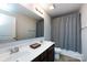 Bathroom boasting a double sink vanity, large mirror, and combination tub and shower with neutral finishes at 15225 Kissimmee Ln, Mint Hill, NC 28227