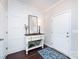 Entryway featuring a console table, elegant decor, and stylish wood floors at 15225 Kissimmee Ln, Mint Hill, NC 28227