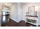 Home entryway boasts dark wood floors, wainscoting, and an elegant console table at 15225 Kissimmee Ln, Mint Hill, NC 28227