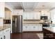 Gourmet kitchen with stainless appliances, granite counters, and white cabinetry at 15225 Kissimmee Ln, Mint Hill, NC 28227