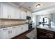 Gourmet kitchen with stainless appliances, granite counters, and white cabinetry at 15225 Kissimmee Ln, Mint Hill, NC 28227