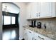 Open kitchen with granite counters, stainless appliances, and views to the dining room at 15225 Kissimmee Ln, Mint Hill, NC 28227