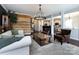 Cozy living room showcasing hardwood floors, a modern chandelier, and an open floor plan at 15225 Kissimmee Ln, Mint Hill, NC 28227