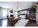 Sophisticated living room with fireplace, stylish decor, and ample seating at 15225 Kissimmee Ln, Mint Hill, NC 28227