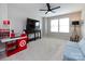 Bright playroom featuring a toy cash register, TV, and cozy blue sofa at 15225 Kissimmee Ln, Mint Hill, NC 28227