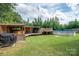 Backyard featuring a pool, covered deck, and grill for outdoor gatherings at 1812 Sam Smith Rd, Fort Mill, SC 29708