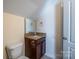 Compact bathroom with granite-look vanity and a framed mirror above the sink at 1812 Sam Smith Rd, Fort Mill, SC 29708