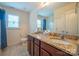 Bathroom with a double sink vanity featuring granite countertops, and tile floors at 1812 Sam Smith Rd, Fort Mill, SC 29708