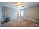 Bedroom with neutral walls, carpet, ceiling fan and ensuite access at 1812 Sam Smith Rd, Fort Mill, SC 29708