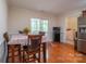 Dining area features a table and chairs with a view to a screened-in back porch at 1812 Sam Smith Rd, Fort Mill, SC 29708