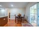 Dining area features a table and chairs with access to a screened-in back porch at 1812 Sam Smith Rd, Fort Mill, SC 29708