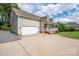 This home has a two-car garage, a long driveway, and a cute covered front porch at 1812 Sam Smith Rd, Fort Mill, SC 29708