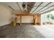 Spacious garage with storage loft, ample natural light, and epoxy-coated floor offering functionality at 1812 Sam Smith Rd, Fort Mill, SC 29708